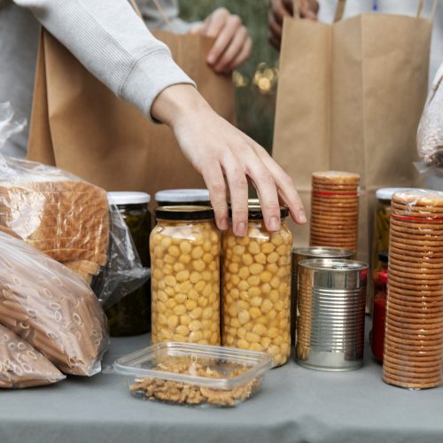close-up-hand-holding-jar